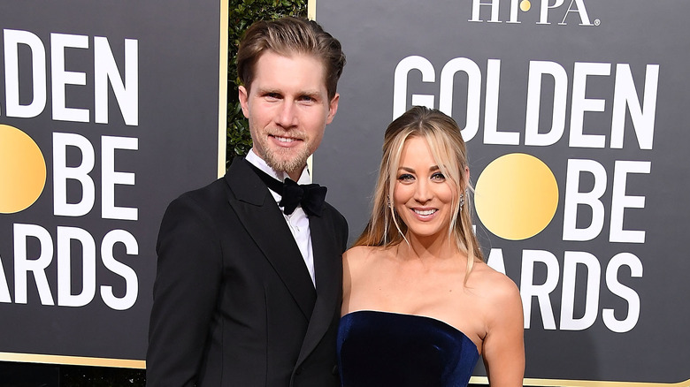 Kaley Cuoco and Karl Cook smiling on the red carpet