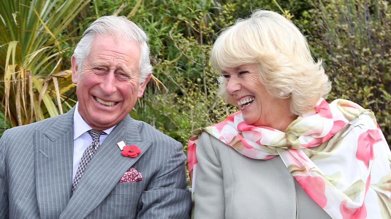 King Charles III and Queen Camilla laughing