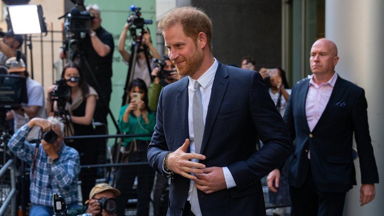 Prince Harry smiling outside