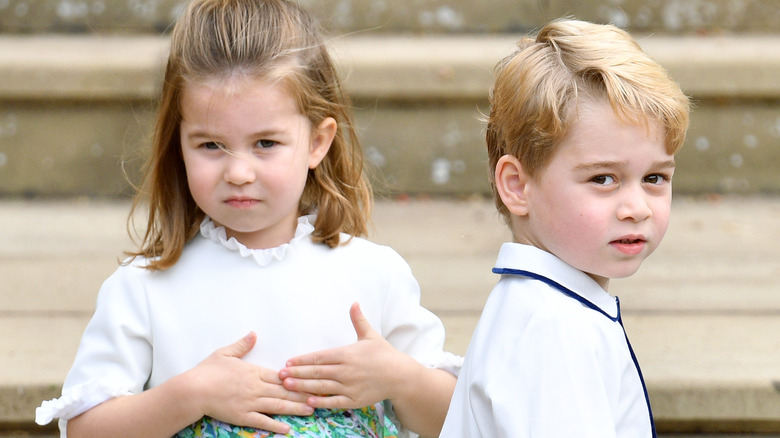 Prince George and Princess Charlotte posing 