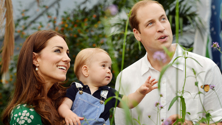 Prince William and Princess Catherine holding baby George 