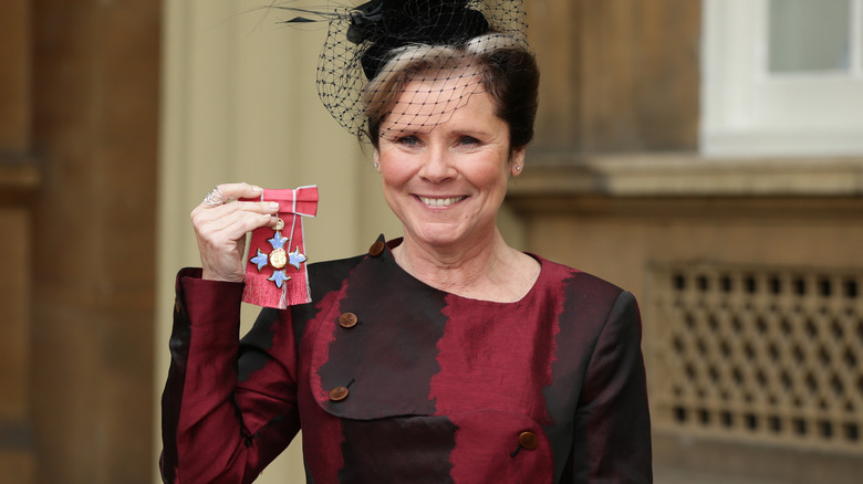 Imelda Staunton holding her CBE