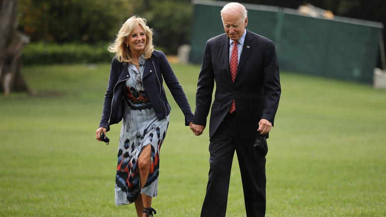 Jill Biden holding hands with Joe Biden