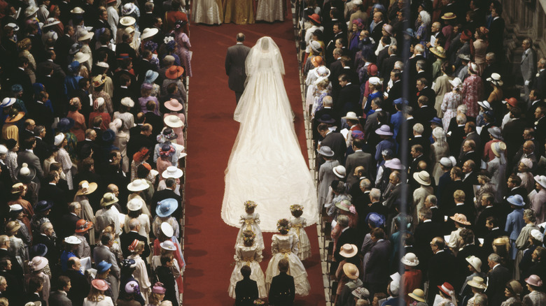 Princess Diana walks down the aisle at her wedding 