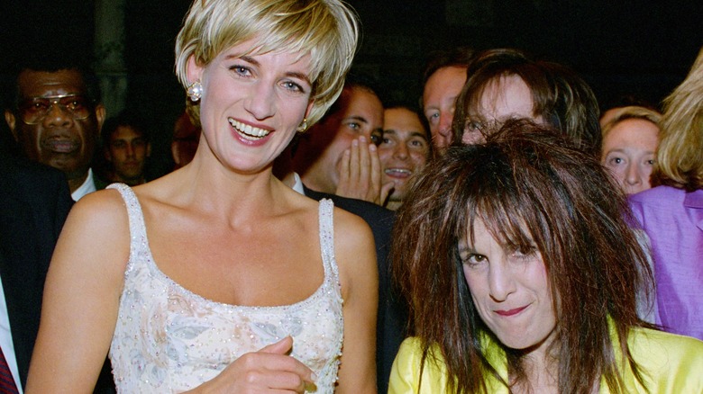 Princess Diana smiles with designer Elizabeth Emanuel