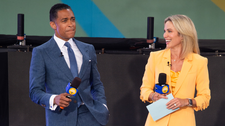 Amy Robach and T.J. Holmes smiling 