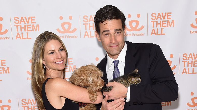 Rob and Eryn Marciano posing with a dog and cat 