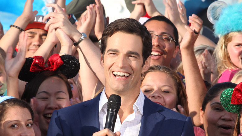 Rob Marciano smiling with a group of GMA fans 