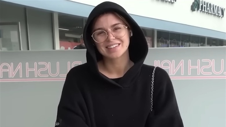 Raquel Leviss in black hoodie and glasses