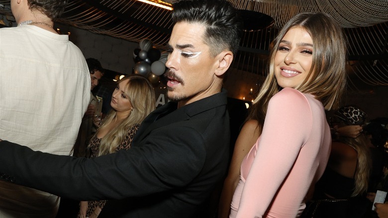 Tom Sandoval dancing and Raquel Leviss smiling 