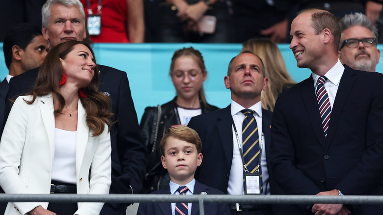 Prince George, Princess Catherine, and Prince William