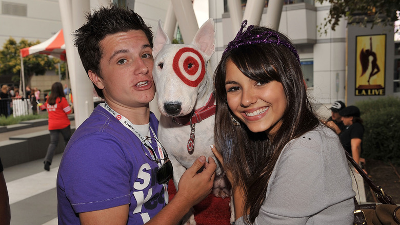 Josh Hutcherson and Victoria Justice posing with the Target mascot at "Target Presents Variety's Power of Youth" event