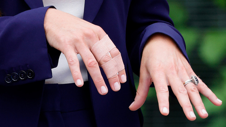 close-up of Kate Middleton's taped fingers