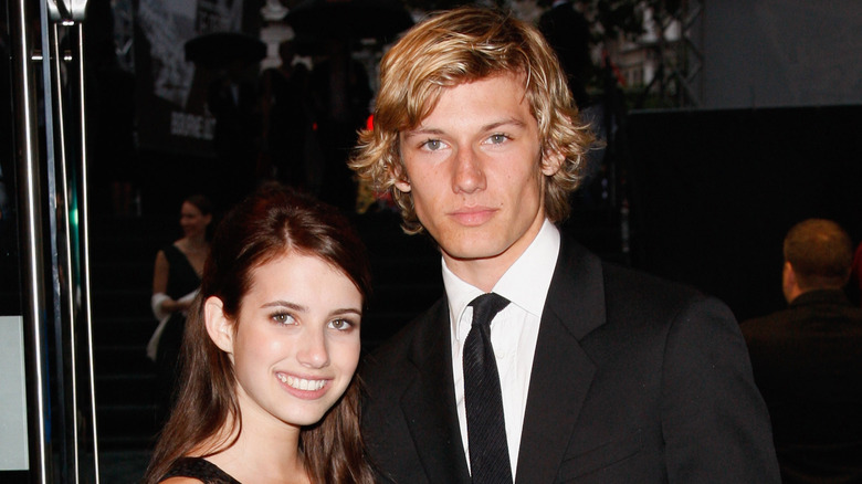 Emma Roberts and Alex Pettyfer posing at an event