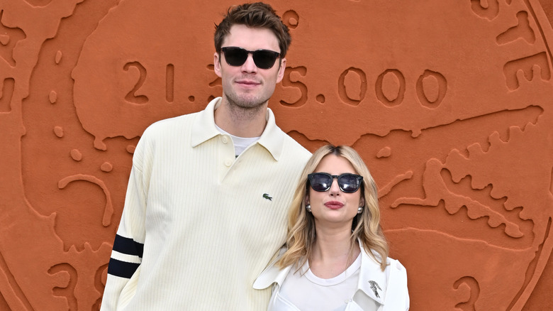 Cody John and Emma Roberts posing in sunglasses