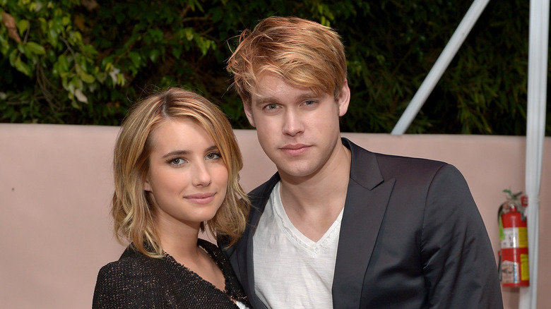 Emma Roberts and Chord Overstreet posing at an event