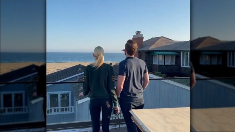 Heather, Tarek showing rooftop deck view