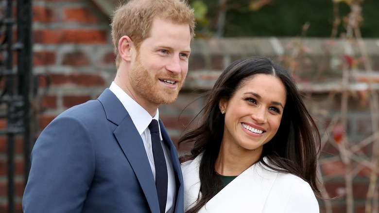 Prince Harry and Meghan Markle smiling during engagement announcement