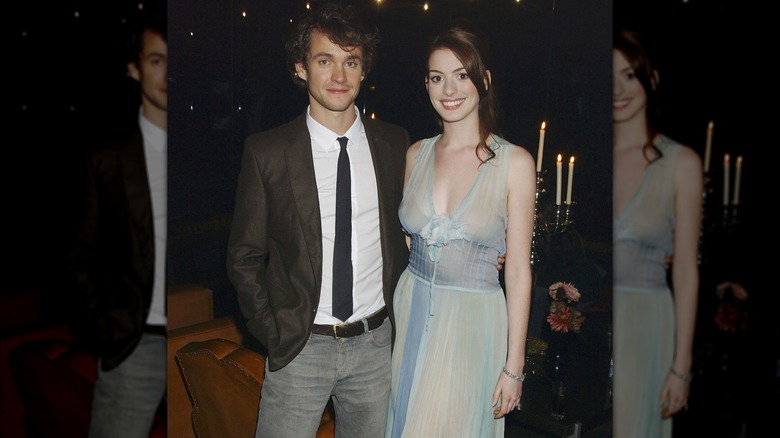 Hugh Dancy and Anne Hathaway smiling