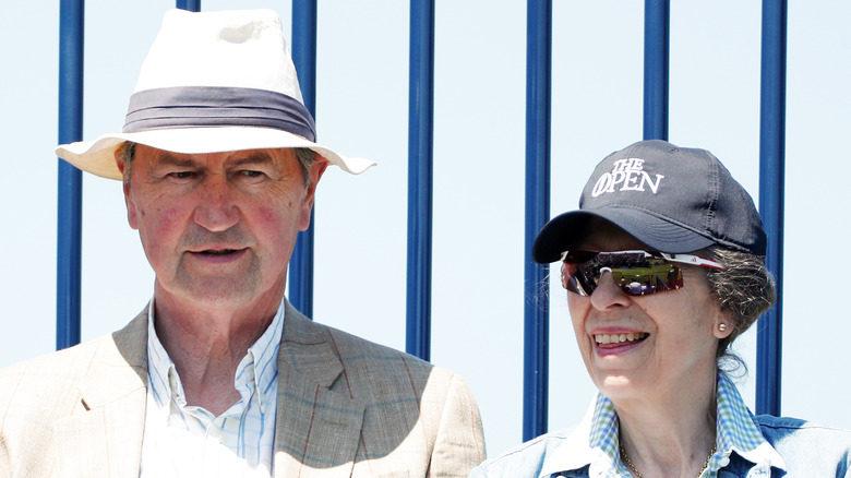 Princess Anne and Timothy Laurence smiling outside