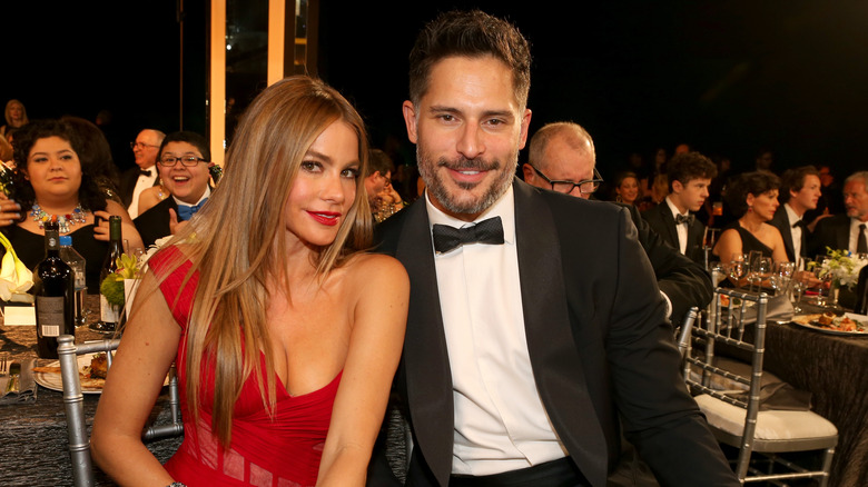 Sofia Vergara and Joe Manganiello smiling evening dress