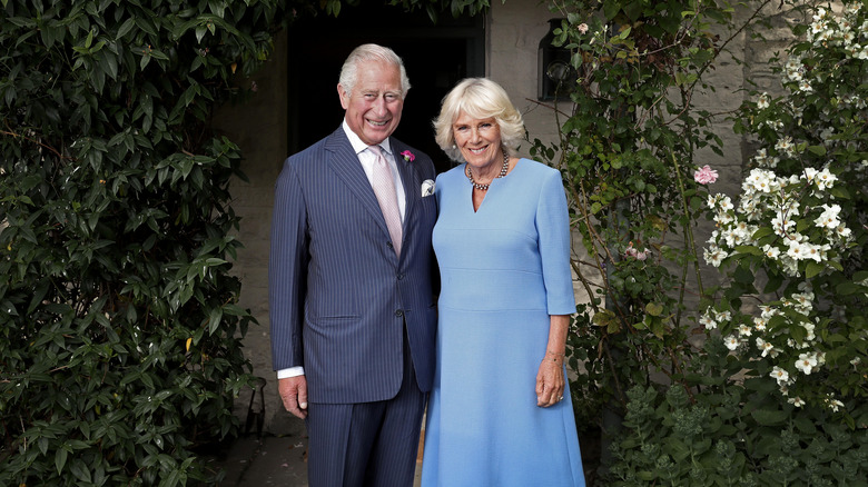 King Charles and Queen Camilla posing for photo