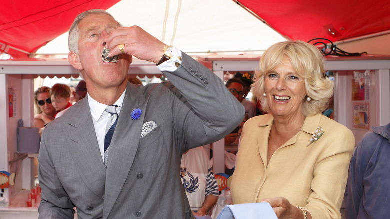 Charles eating an oyster 