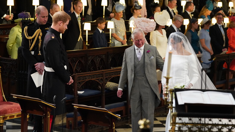 King Charles walking Meghan Markle down the aisle