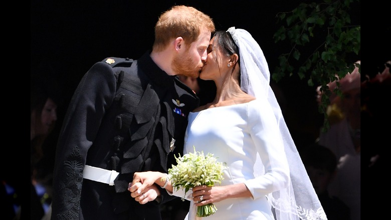 Prince Harry and Meghan Markle kissing