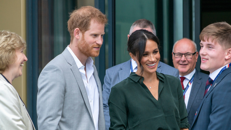 Prince Harry and Meghan Markle meeting people