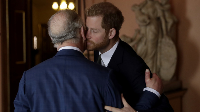 Prince Harry kissing Charles' cheek