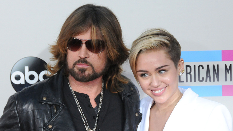 Billy Ray Cyrus and Miley Cyrus smiling