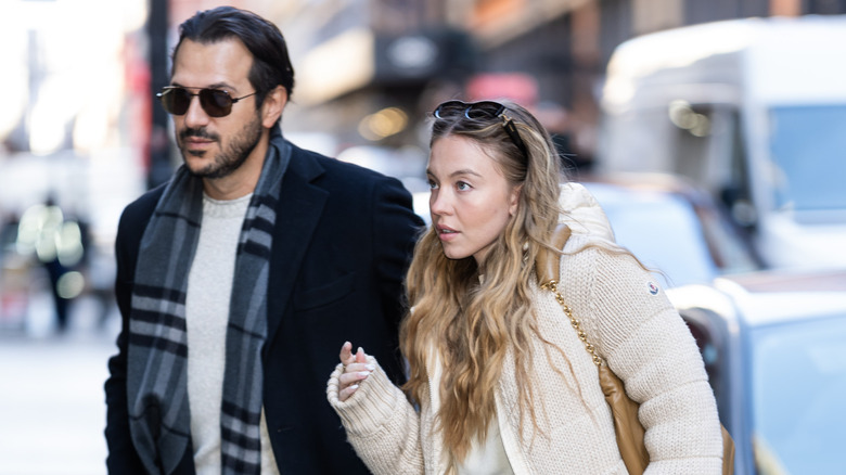 Sydney Sweeney and Jonathan Davino walk together