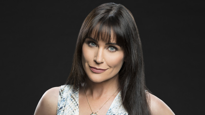 Rena Sofer smirking