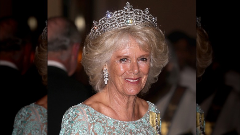 Camilla smiling and wearing the Greville tiara