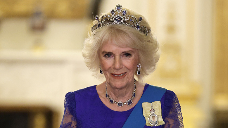 Camilla smiling and wearing the Belgian sapphire tiara