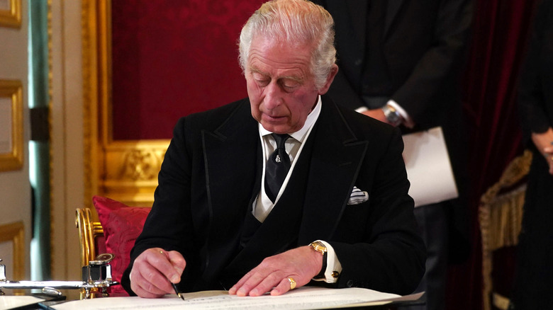 King Charles III signing oath 