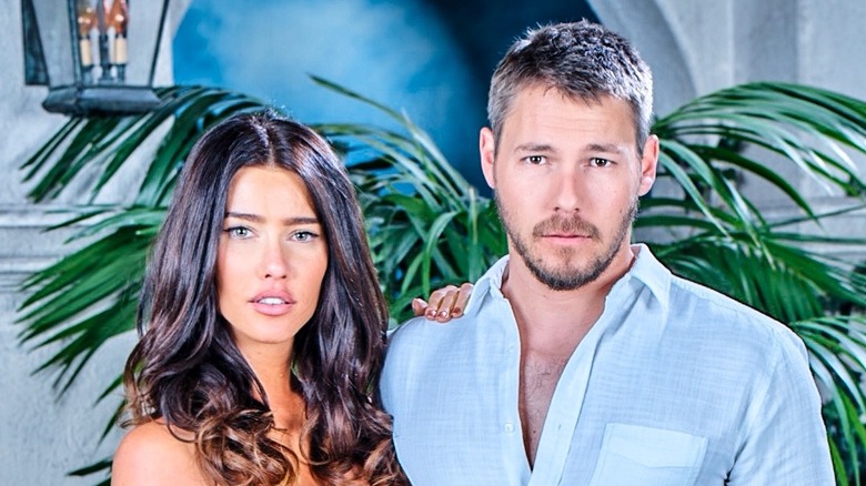 Jacqueline MacInnes Wood and Scott Clifton posing