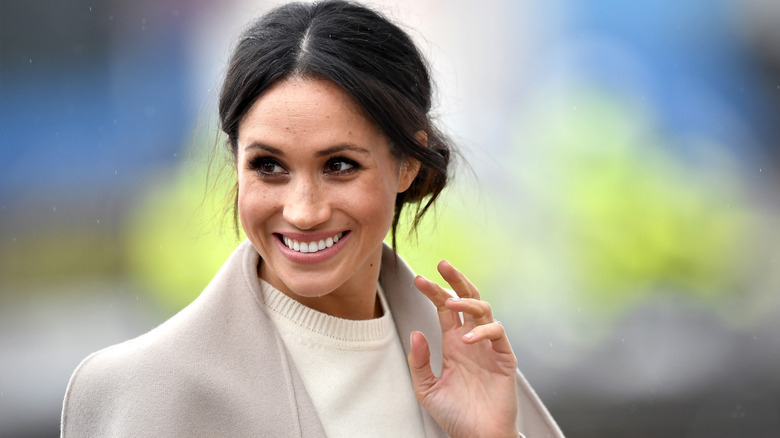 Meghan Markle waving at the camera