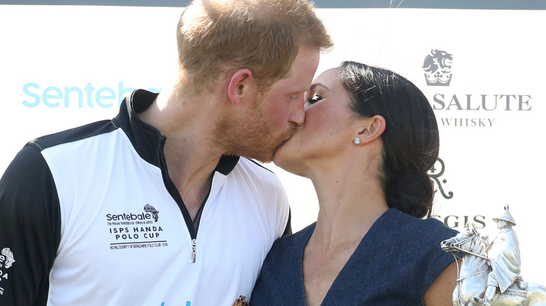 Prince Harry and Meghan Markle kissing