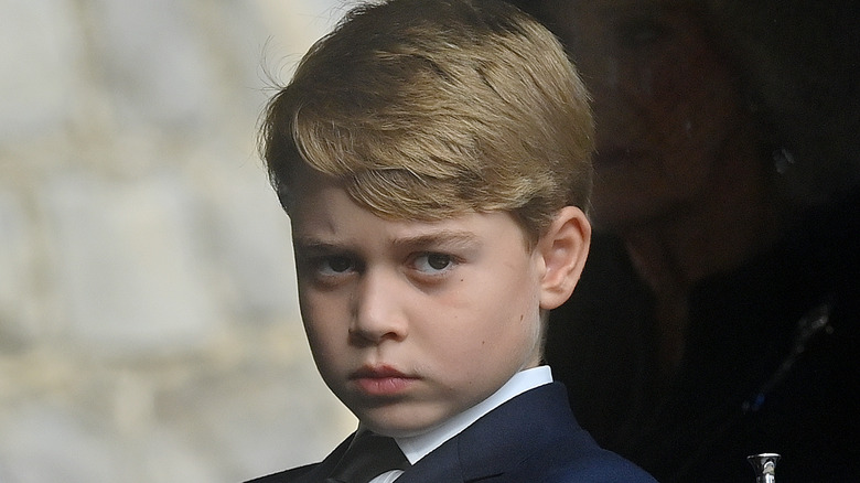 Prince George frowning