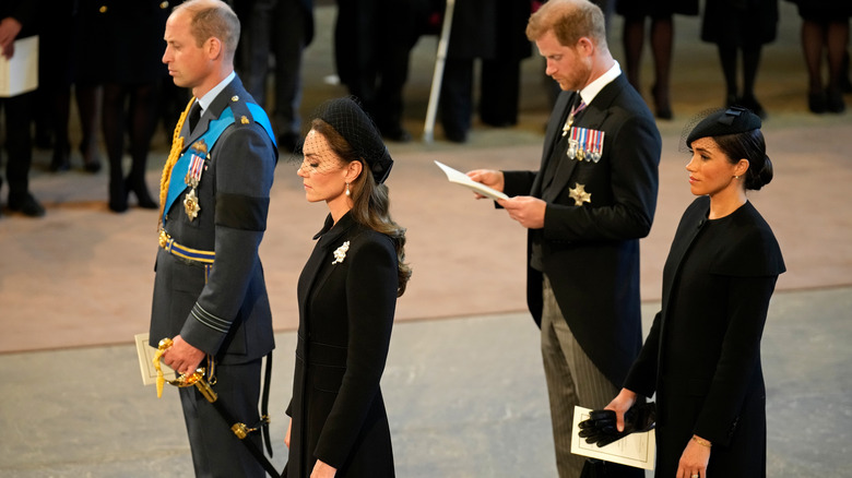 Prince William, Princess Catherine, Prince Harry, and Meghan Markle pictured at the queen's funeral