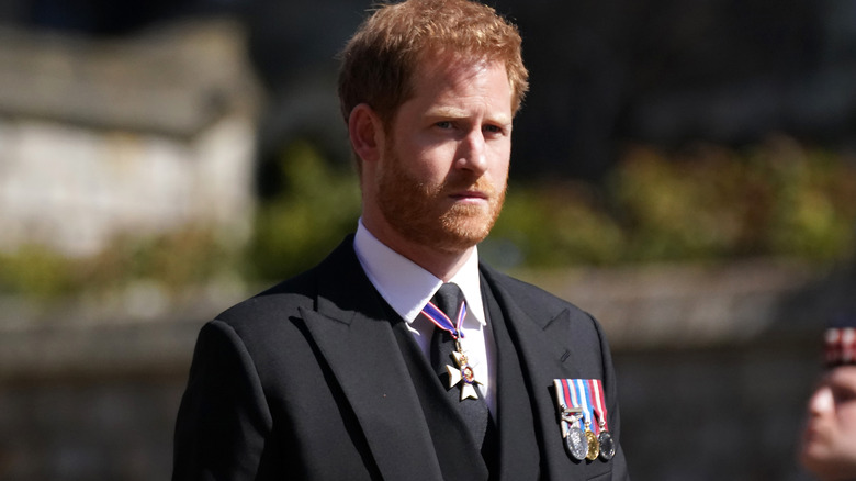 Prince Harry wearing a uniform outdoors