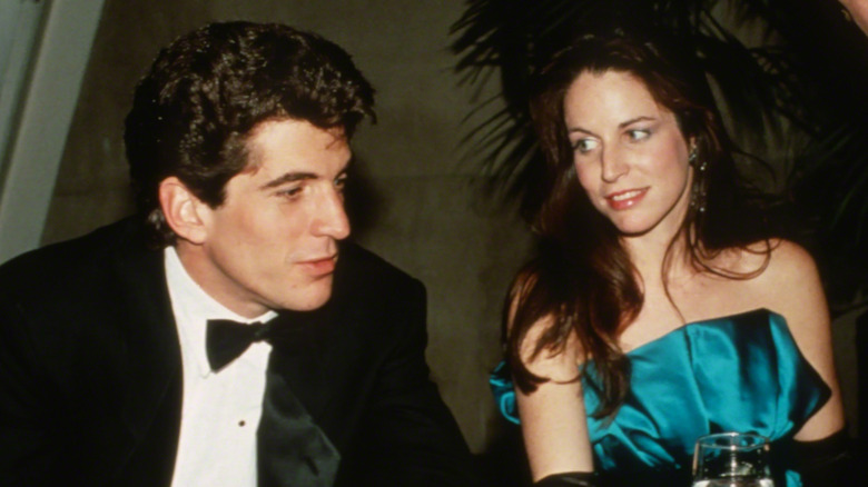 JFK Jr. and Christina Haag seated and talking