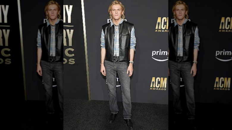 Davis Burleson in a leather vest on the red carpet