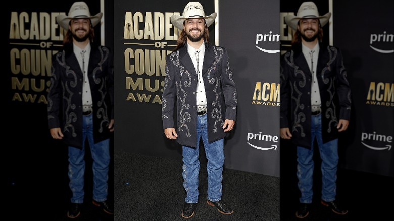 Ian Munsick posing on red carpet in bedazzled jacket