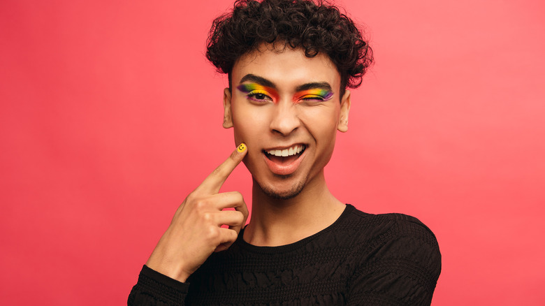 Man wearing rainbow eyeshadow