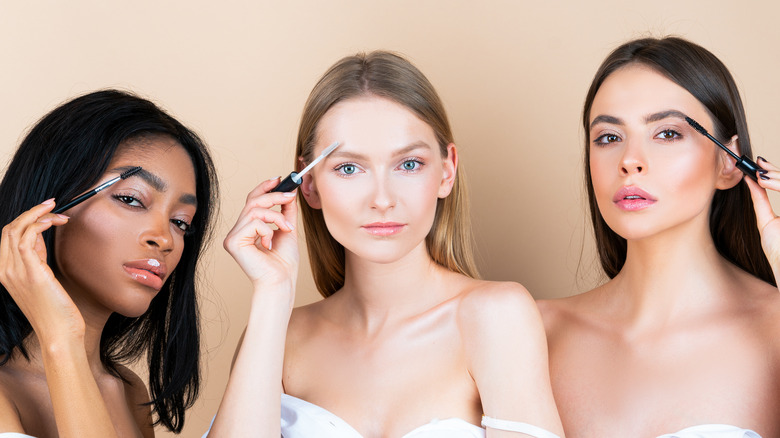 Women applying makeup