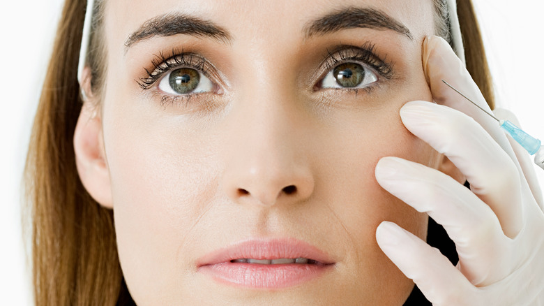 A woman getting under-eye fillers