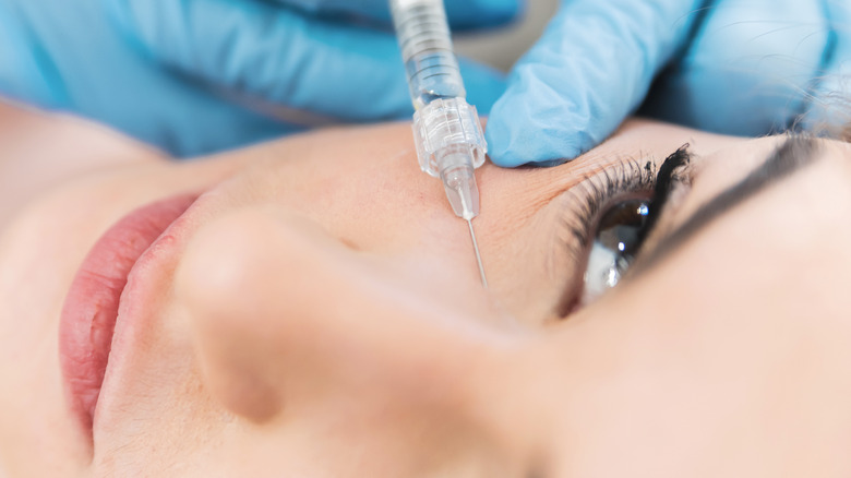 A woman getting under-eye fillers